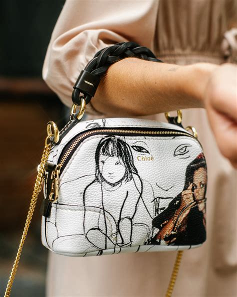 Introducing the Chloé Mini Daria Bag .